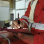 side-view-man-taking-notes-ambulance-car (1)