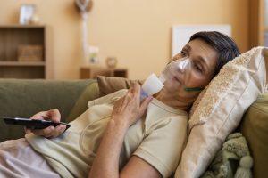 side view woman using nebulizer